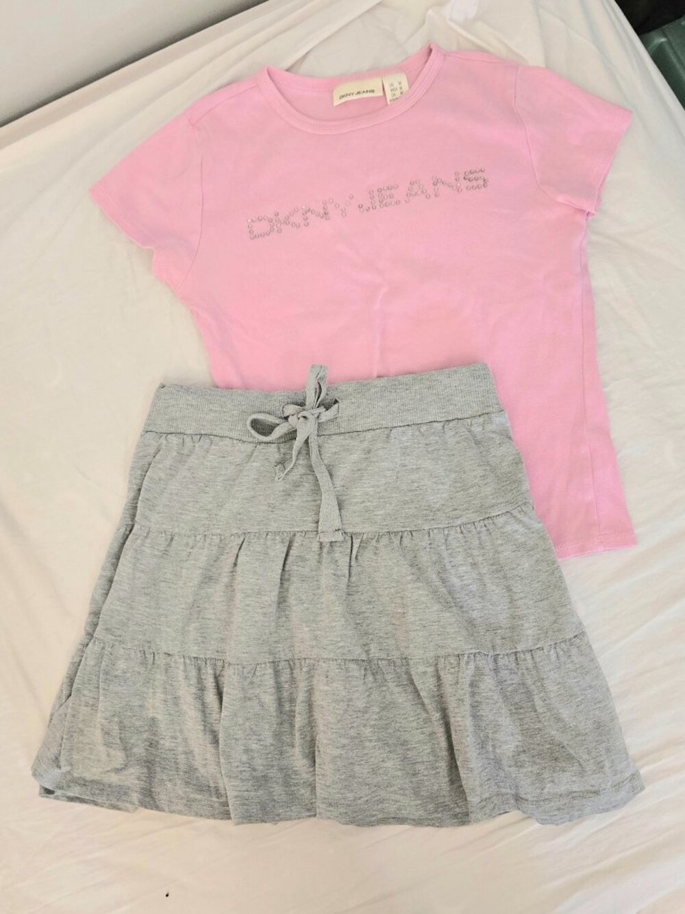DKNY pink top and grey skirt